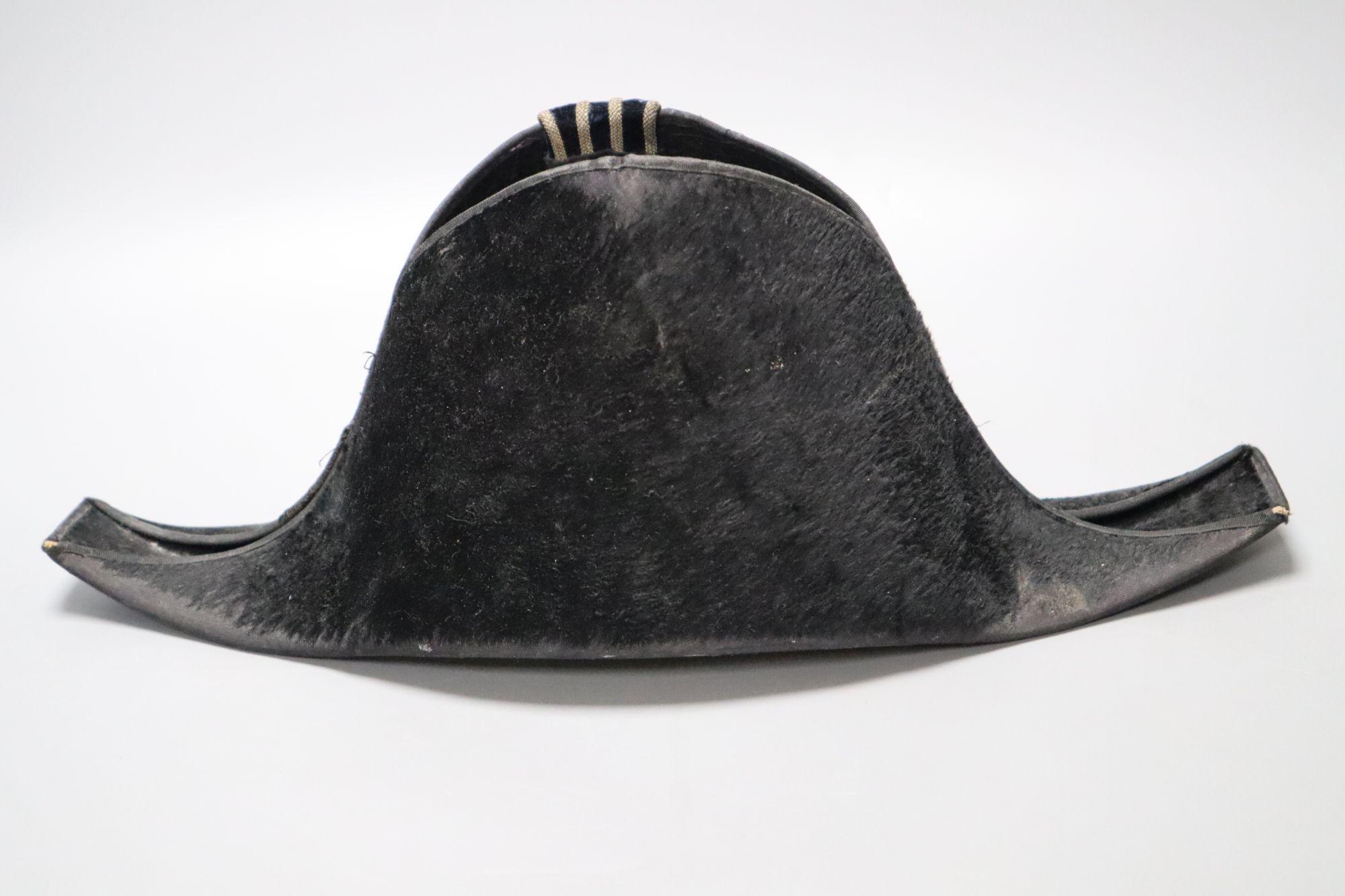A WWI bicorn naval hat with Kings crown button
